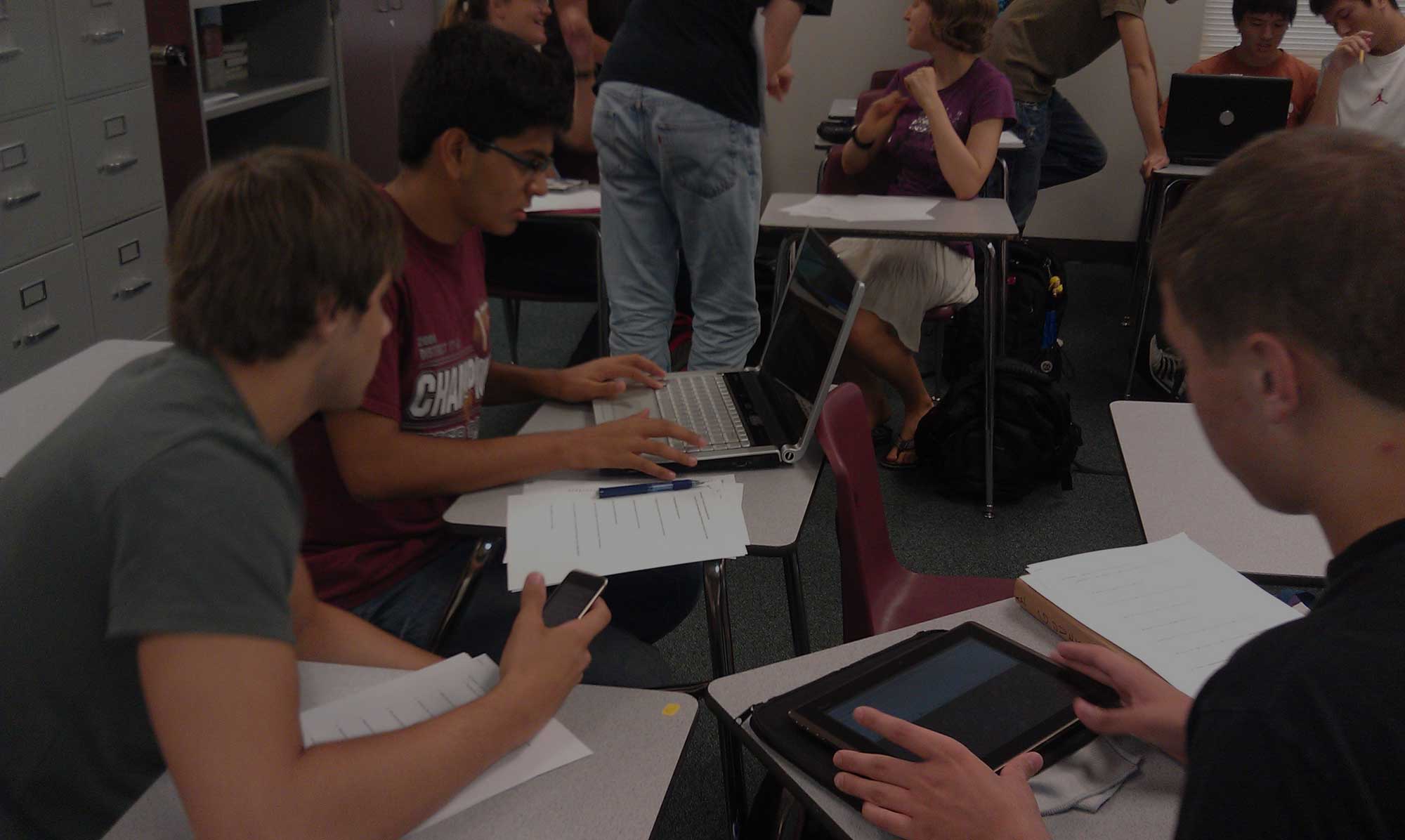 High School students using multiple byod devices for learning in the classroom
