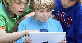 students using iPads in the classroom
