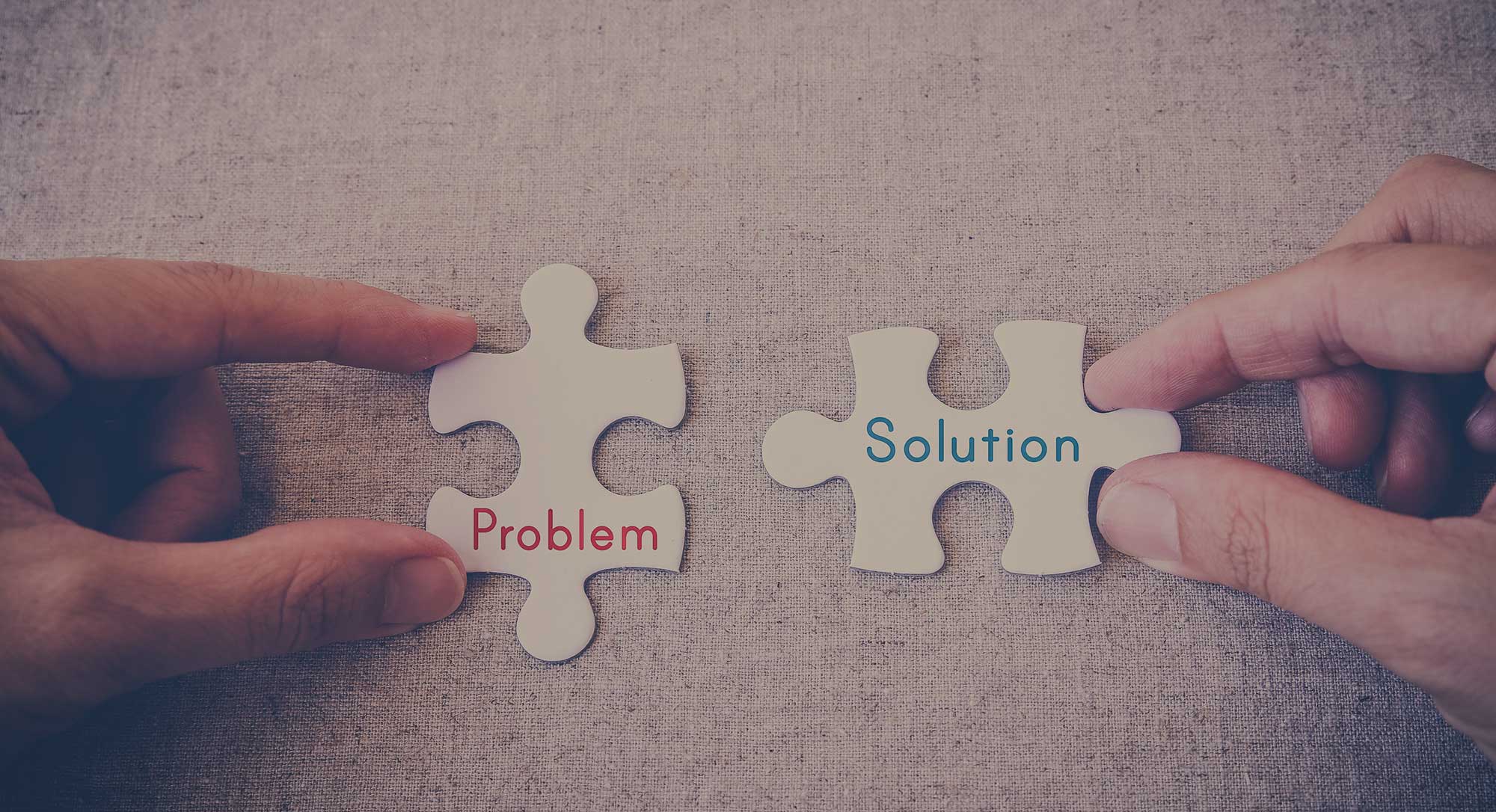 puzzle pieces of problem and solution being connected together