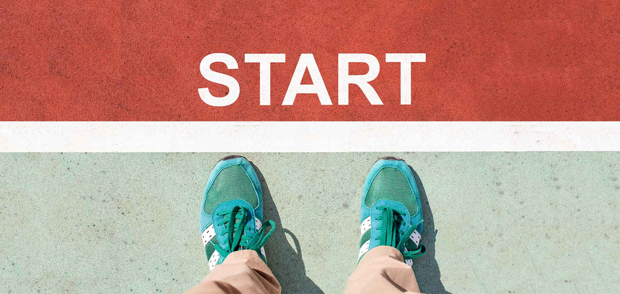 Blue running shoes standing on the starting line of a foot race