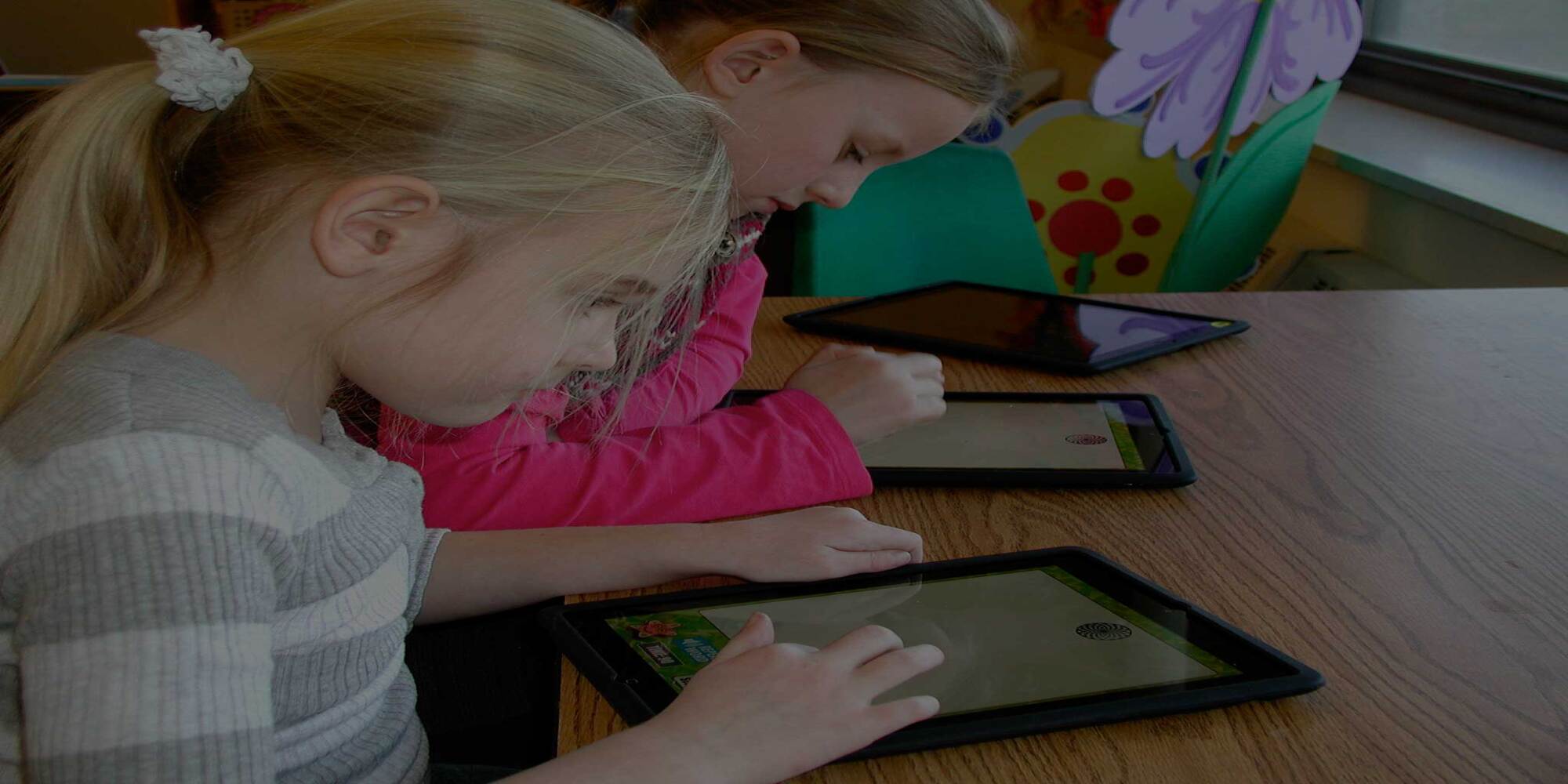 Students using iPads in the classroom at their desks